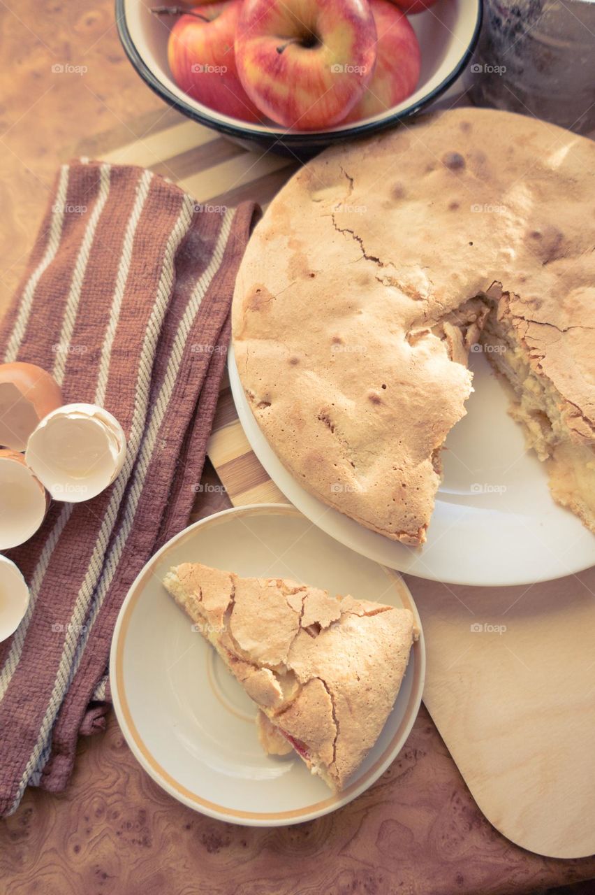 Making homemade puffed apple pie with eggs, sugar and flour.