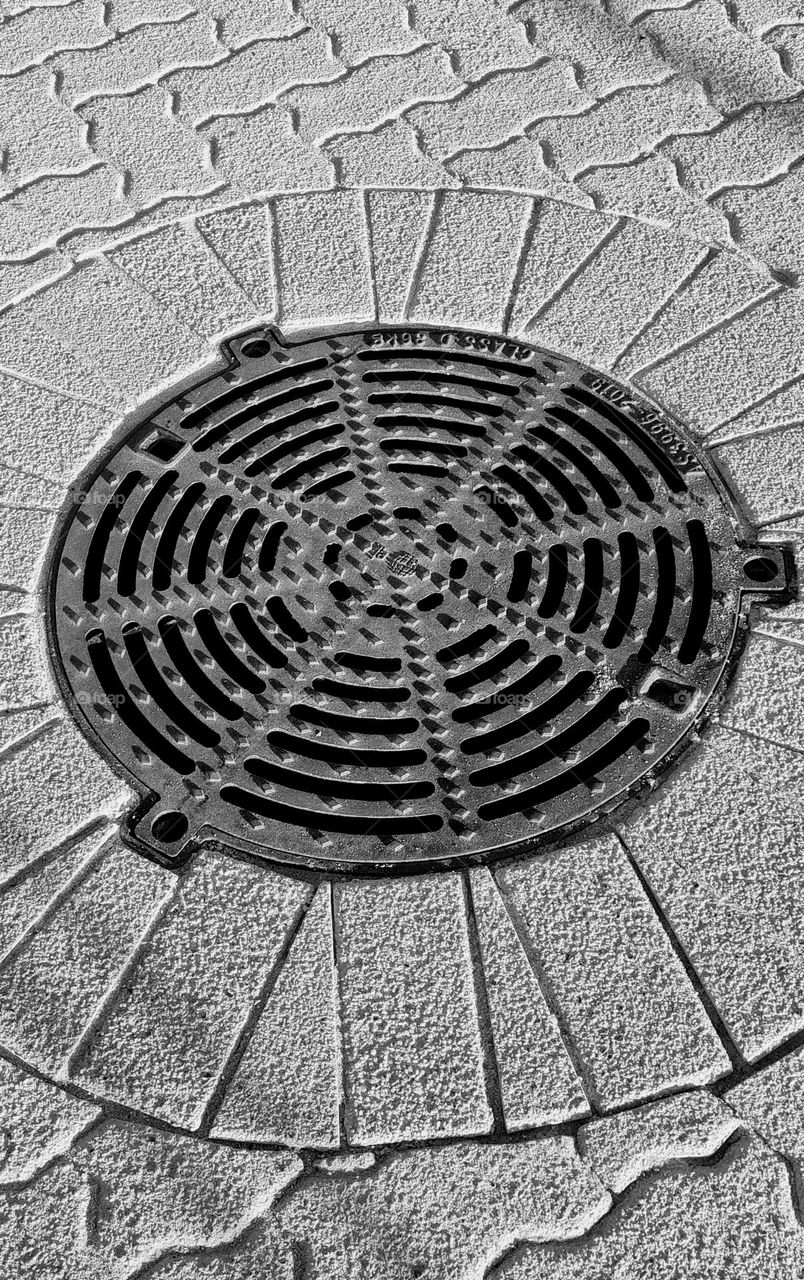 Metal grate on the sidewalk