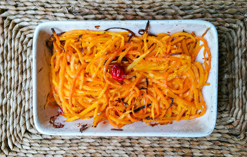Orange Squash Pasta / Spaghetti topped with a cranberry