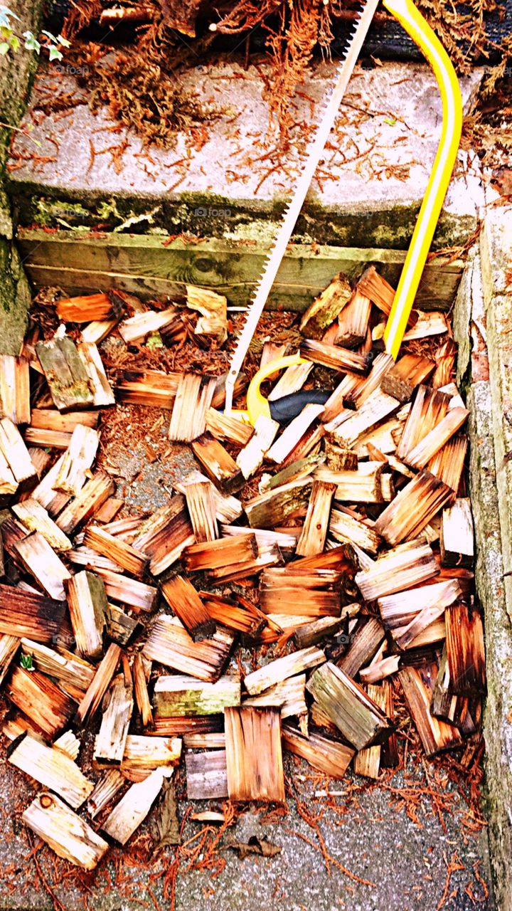 Preparation for outdoor cooking 
Wood chipping and saw 