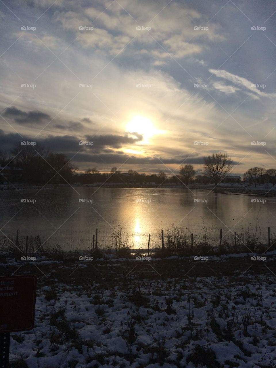 Winter sunset icy lake 