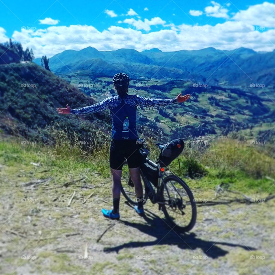 Cycling in the Andes mountains! Bike high up backdrop while cycling in the gravel roads of the Andes! Riding a titanium bicycle and wearing a feathered jersey!