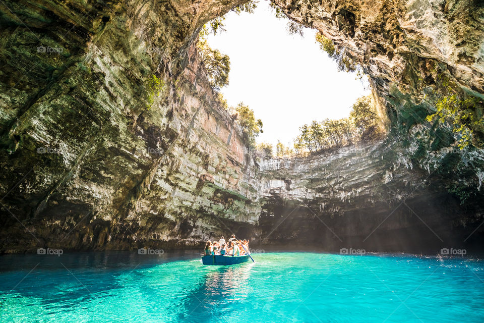 Tourists With Wooden Boat Visit Famous Cave Lake Melissani In Kefalonia Greek Island