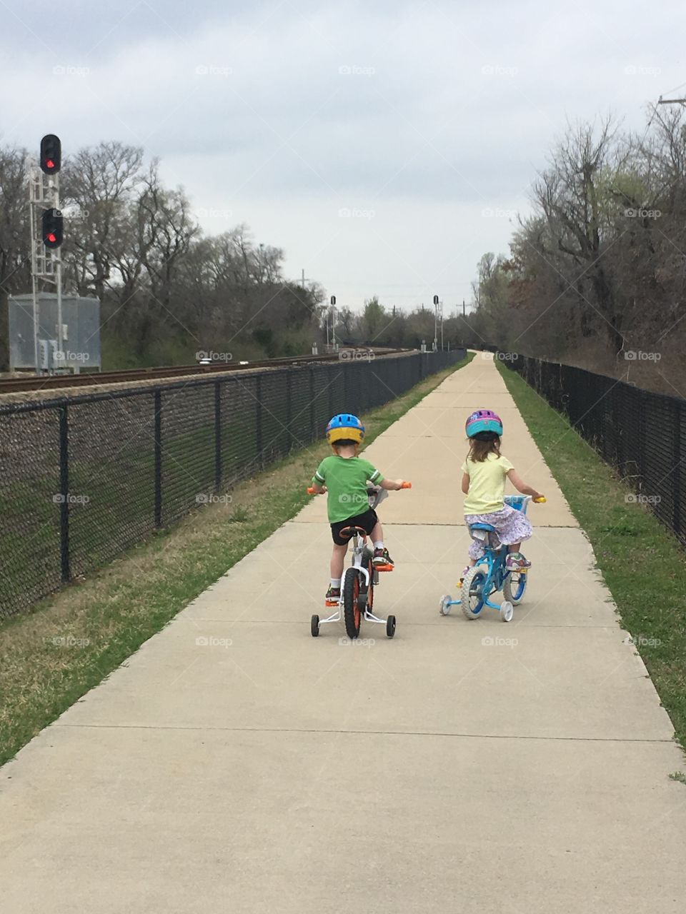 Boy and girl riding bike