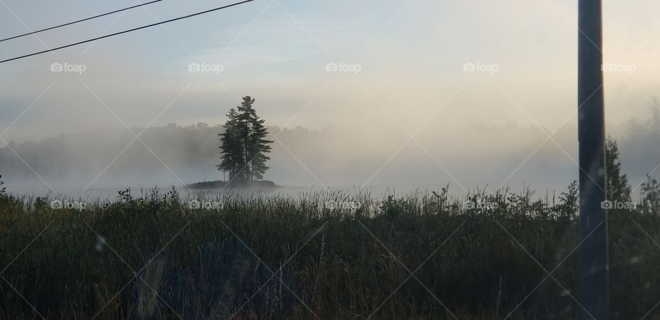 island in the mist of the morning, lake in Bancroft, ont.