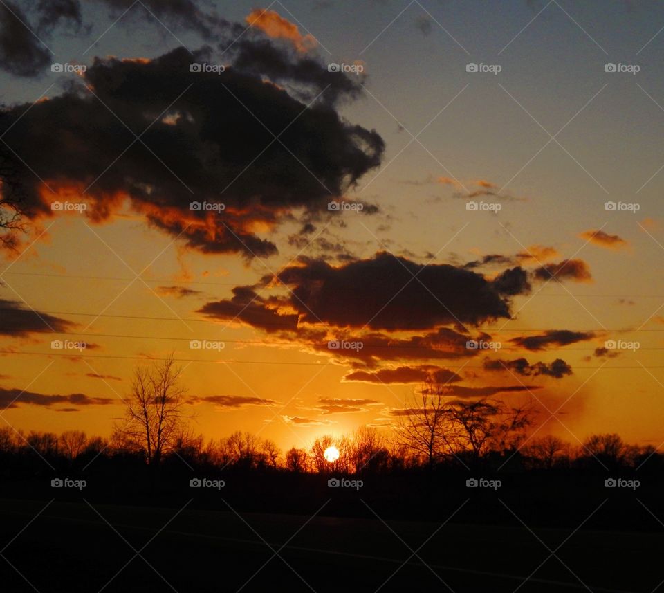 orange sunset just before it goes below the horizon