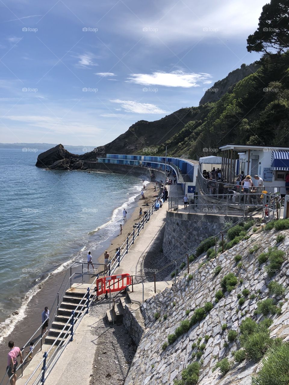 Summer photo of Meadfoot Beach, cafe end on a glorious sunny day.