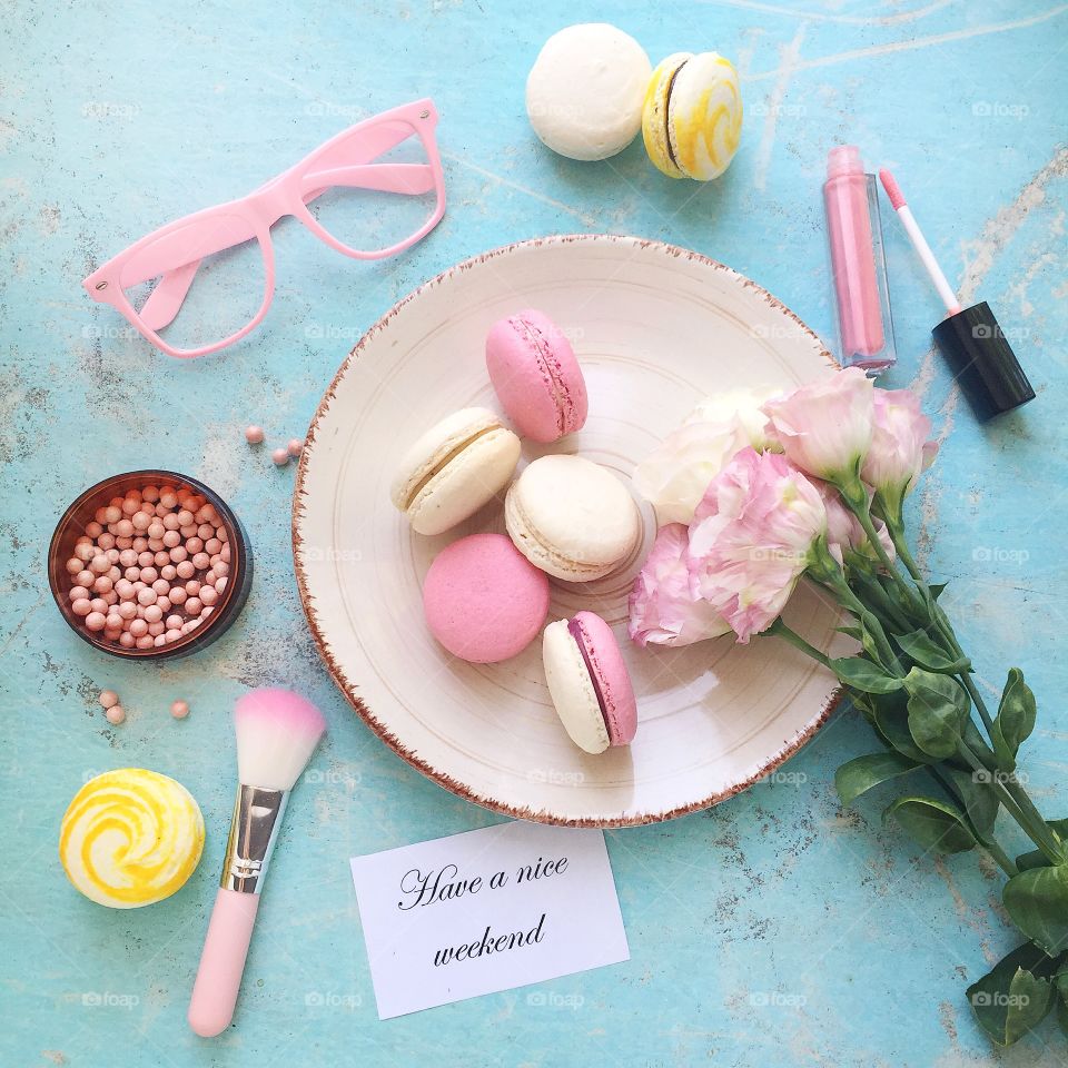 Flat lay with macaroons on blue background