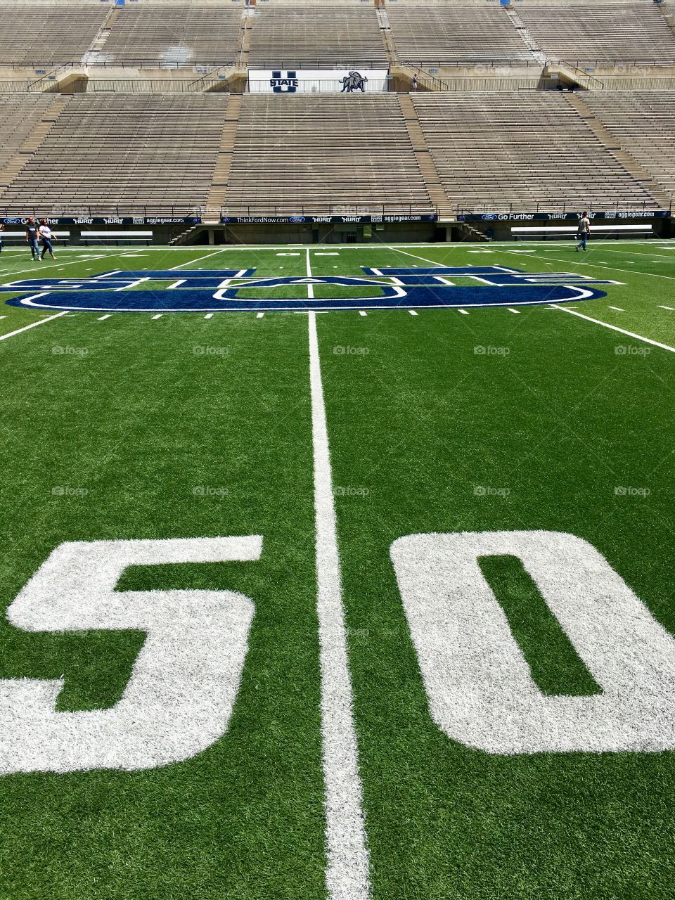 Green story. Green turf. Football field. Fifty yard line. Sports. Utah State University. 