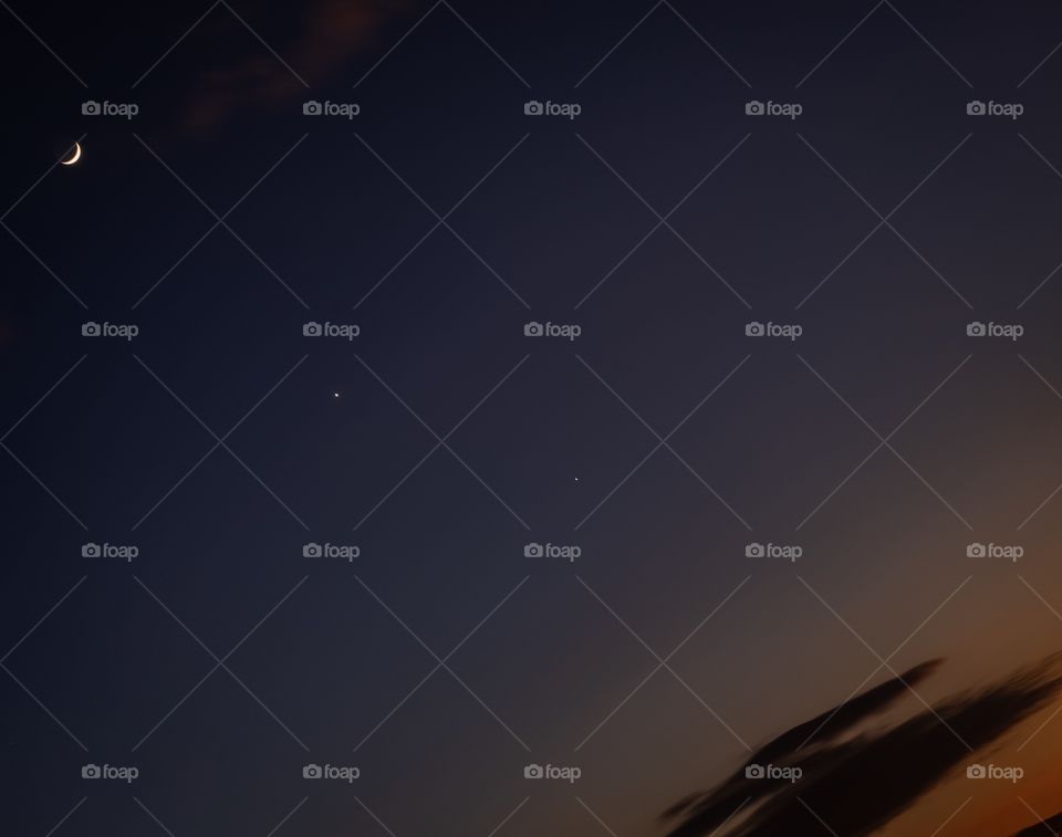 Bangkok/Thailand-November 28 2019: Phenomenon in the sky at Bangkok.The Moon,Venus star and Jupiter Star arrange to be a beautiful line on twilight moment