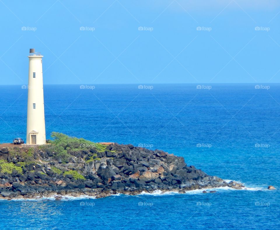 Lighthouse On A Blue Ocean