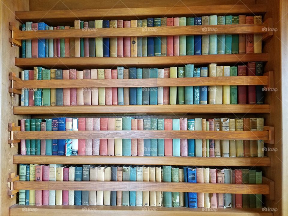 Colorful antique books on shelves