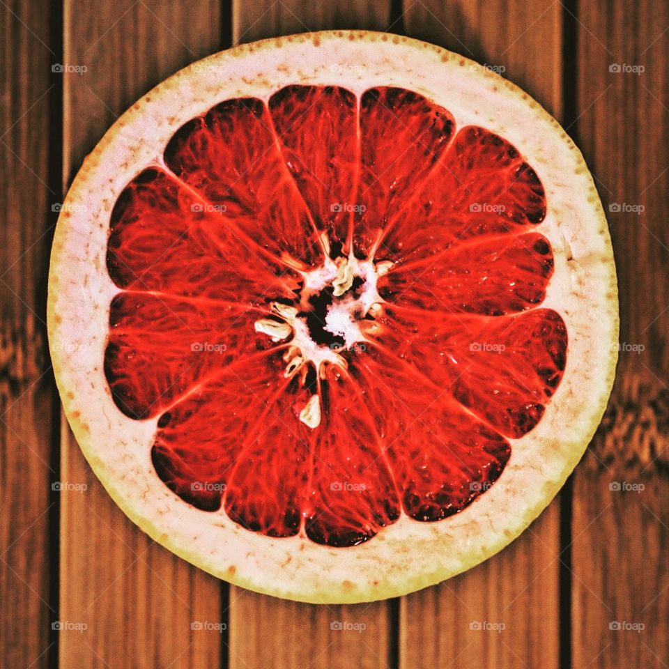 Grapefruit cut in half, making fruit delicious, summertime fruits, eating grapefruit at home, making juice at home 