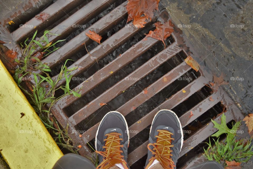 Standing on a drain during a rainstorm. it is like a mini cascade.  Beaver, PA