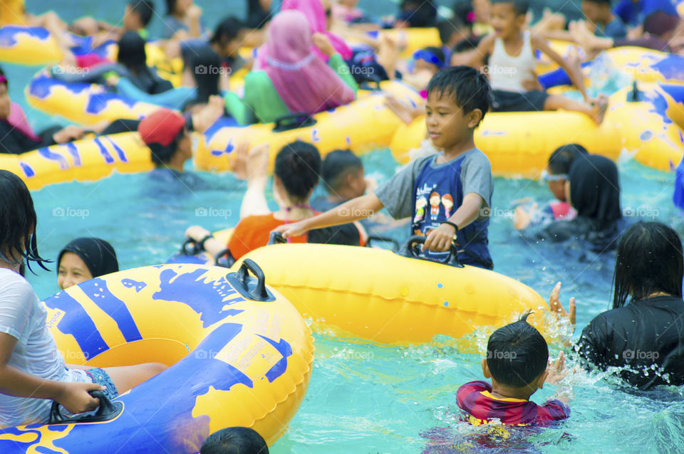 People enjoying in swimming pool