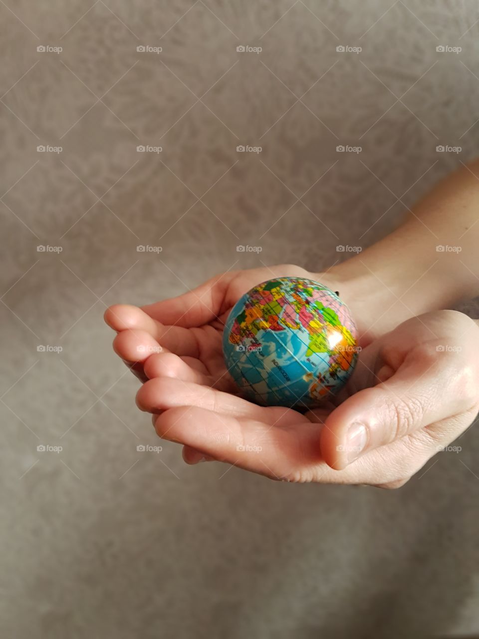 Globe in hands