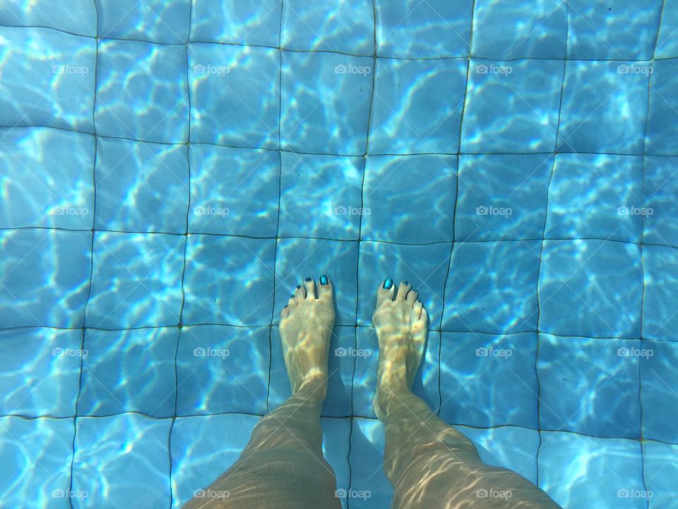 A view of my feet while enjoying some backyard pool time