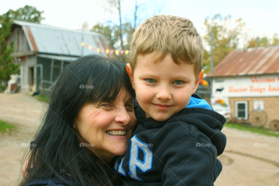 Grandmother carrying her grandson