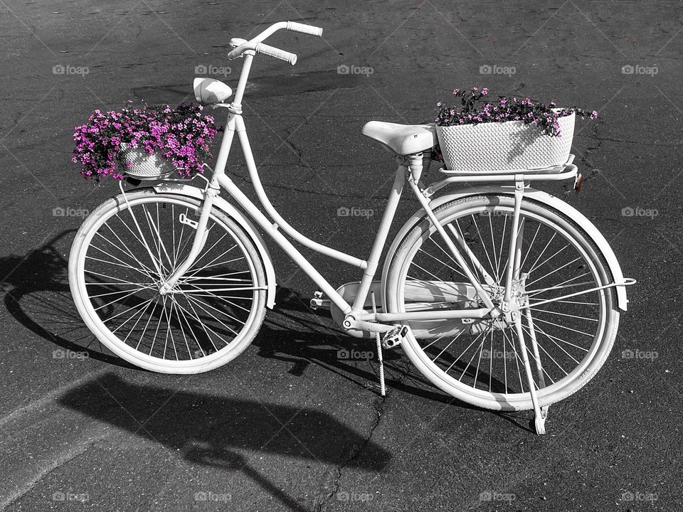 White bicycle with flowers 