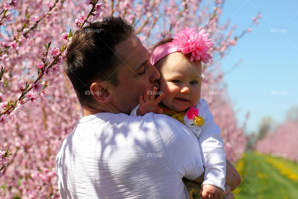 Father carrying his daughter