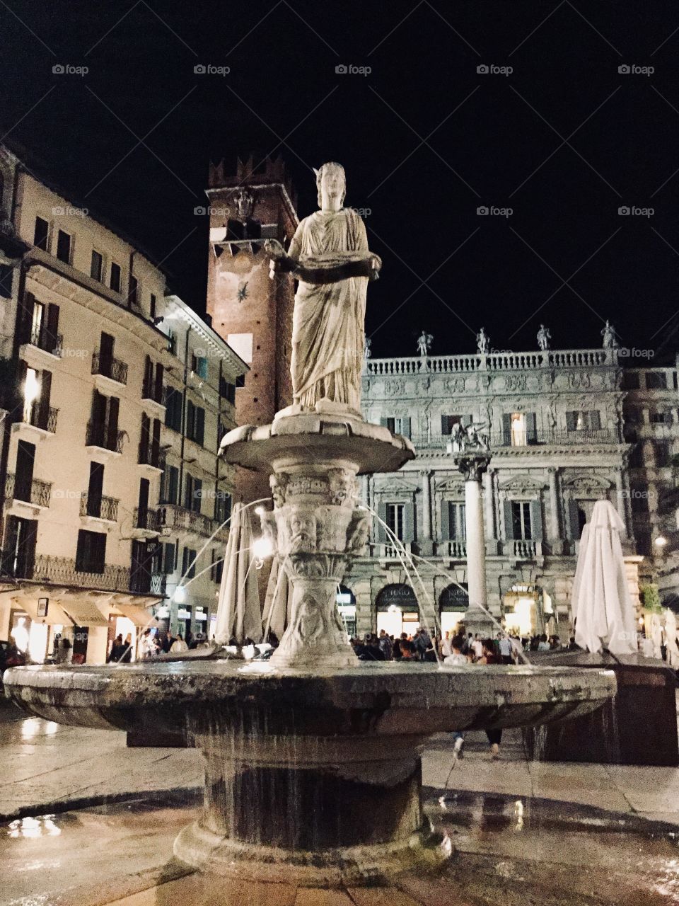 Verona by night - a square  and a fountain 