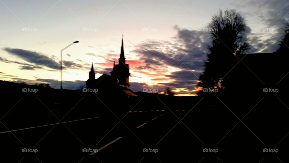 Beautiful sunset in the background of a church!