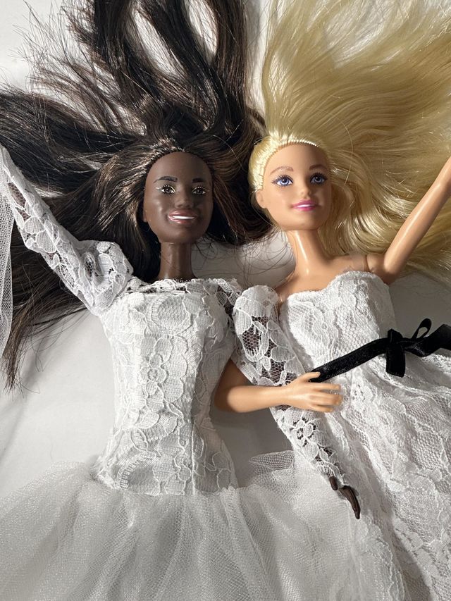 Barbie, now 64, finally ties the knot with her long time companion. And it isn’t Ken - “he’s always been just a friend.” Two Barbie dolls in wedding dresses celebrating their love.