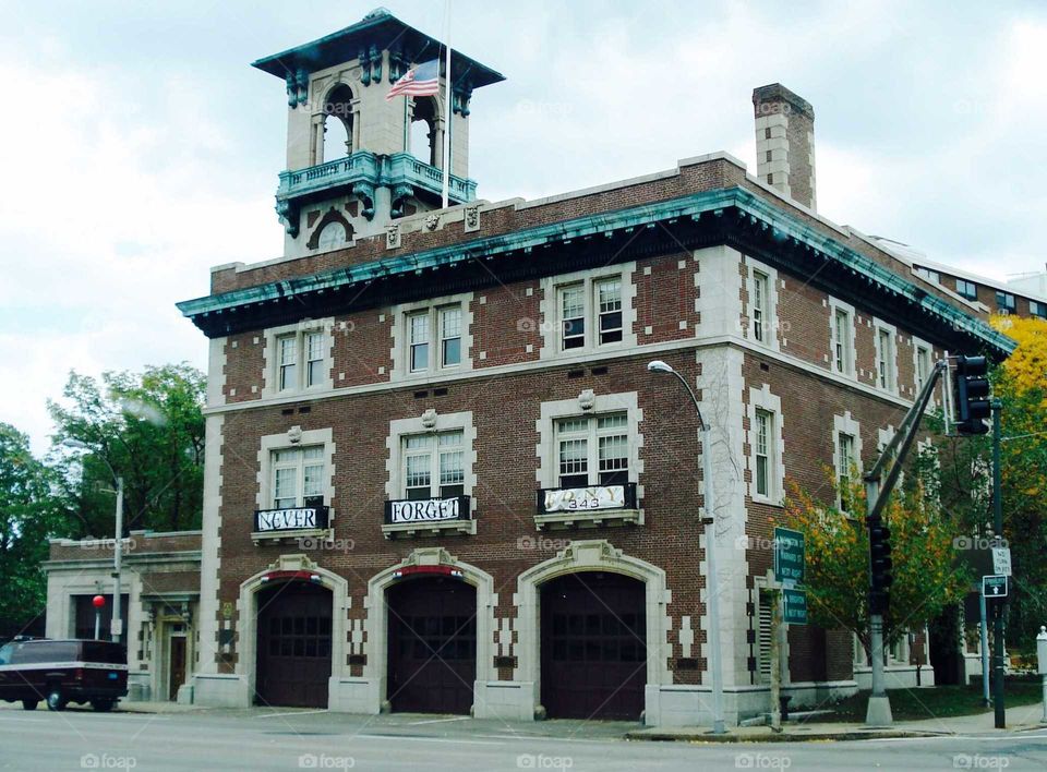 Old city Fire Station flying American Flag & banner Never Forget as remembrance for 9/11/2001🇺🇸 Brick Architecture