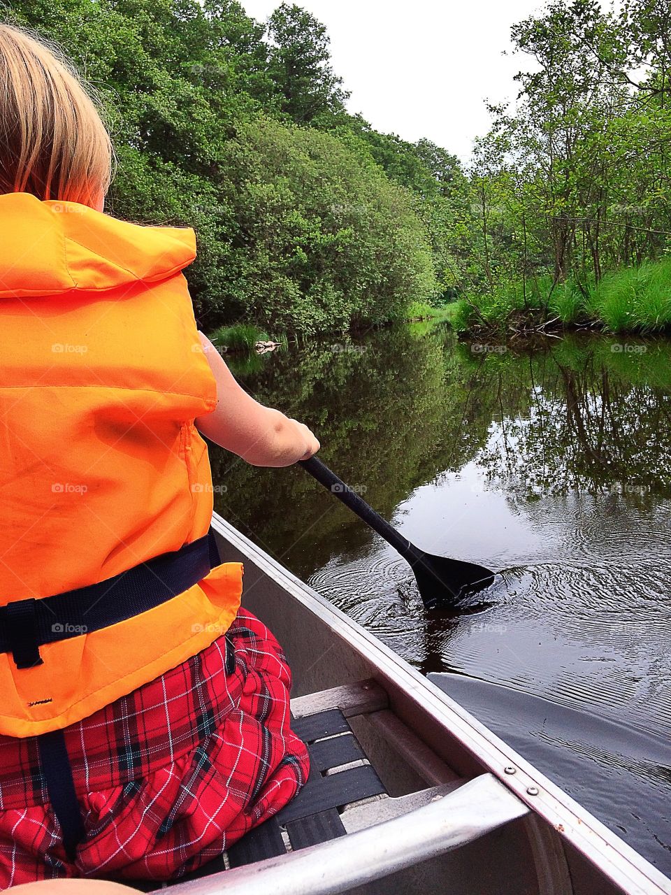 Canoe. Canoeing down the river