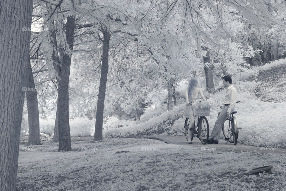 Couple taking a bike ride. Couple stop for a talk while riding bikes