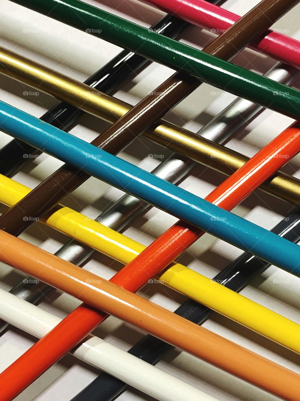 Piled on colored pencils body.