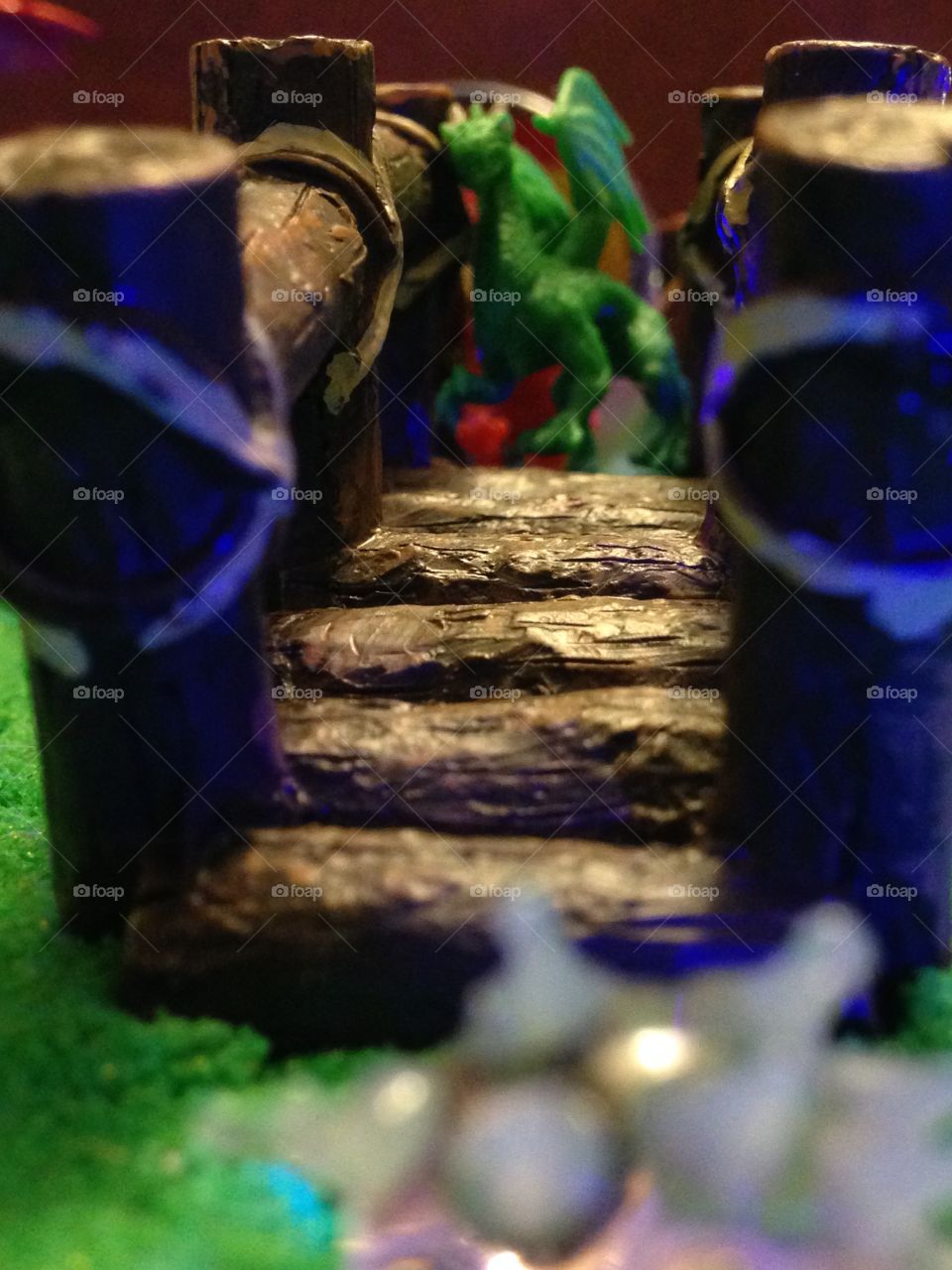 Bridge with green dragon on it and colorful blurry background