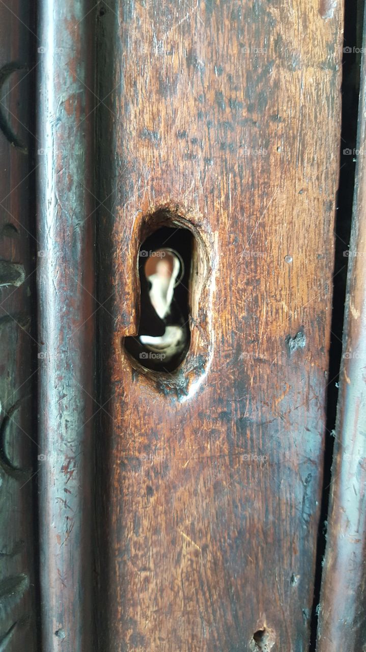 view from an old door and a key hole