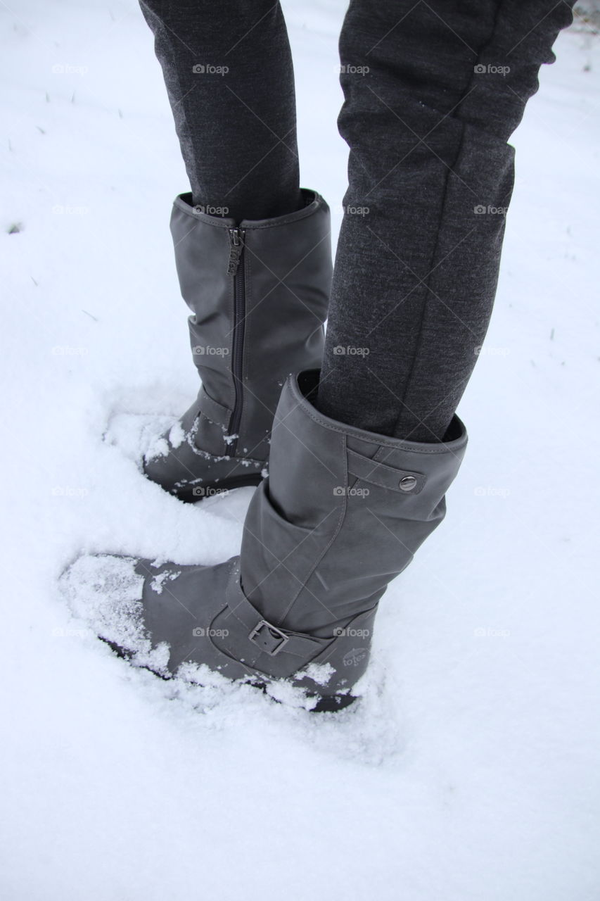 Woman wearing Totes boots in the snow