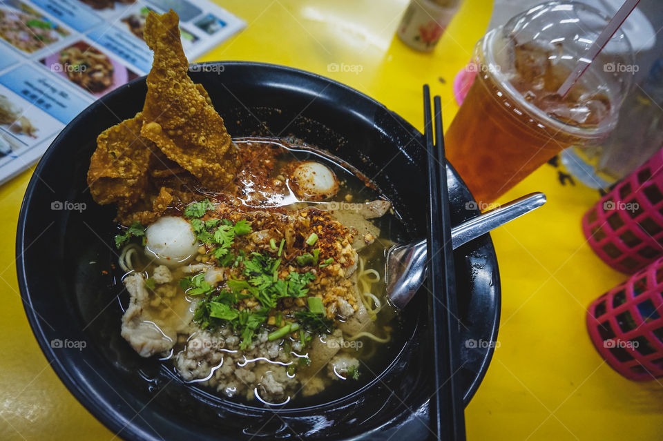Thai noodle soup with pork and bael fruit tea