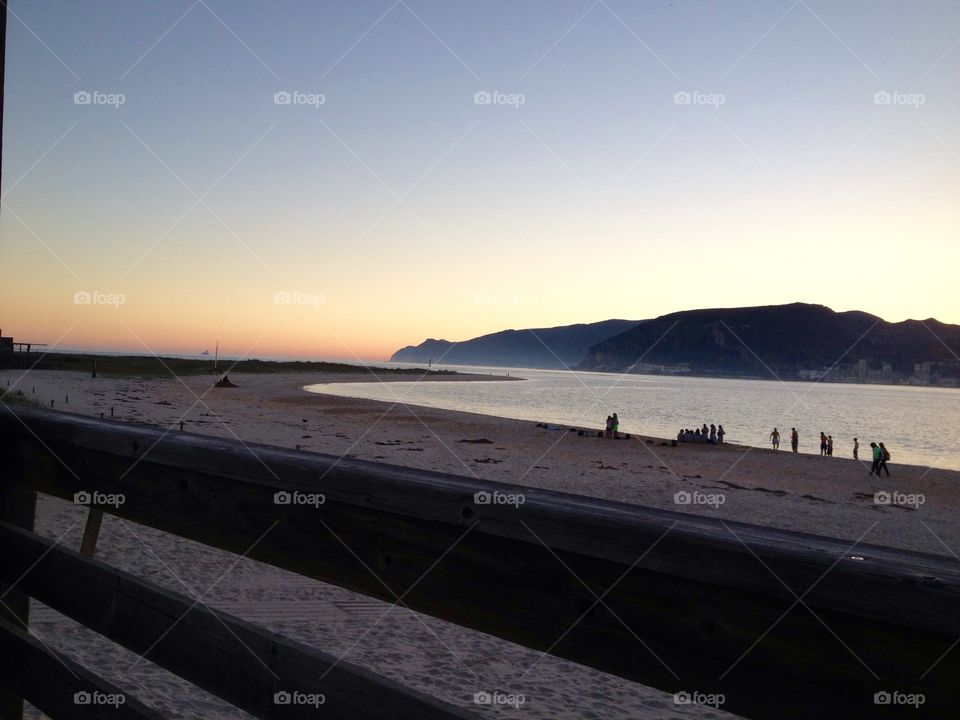 People at the beach, sunset 