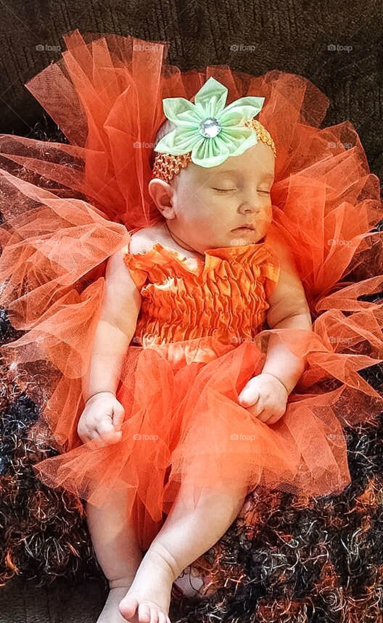 Sleeping baby in Halloween costume 