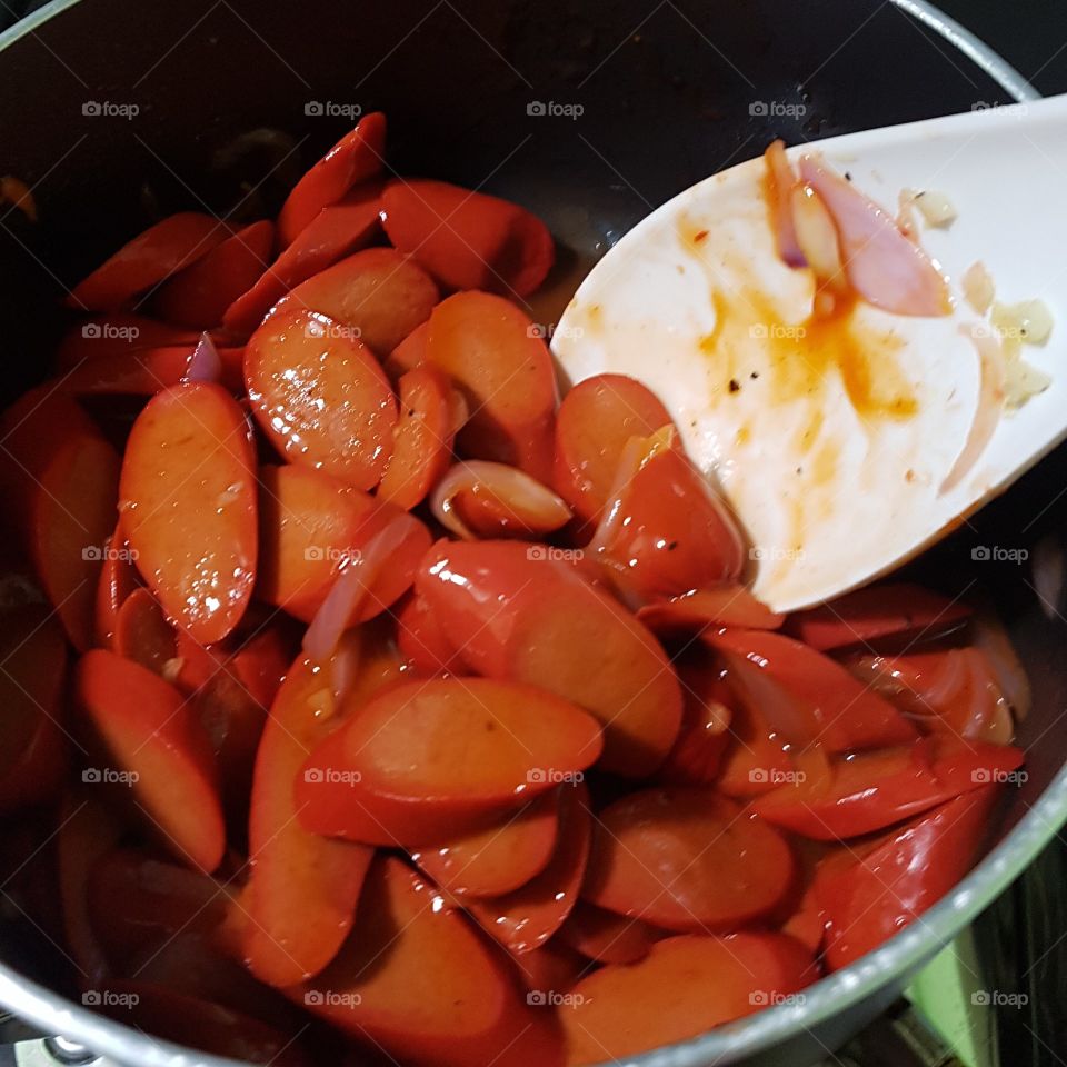 sauteed hotdog with ketchup