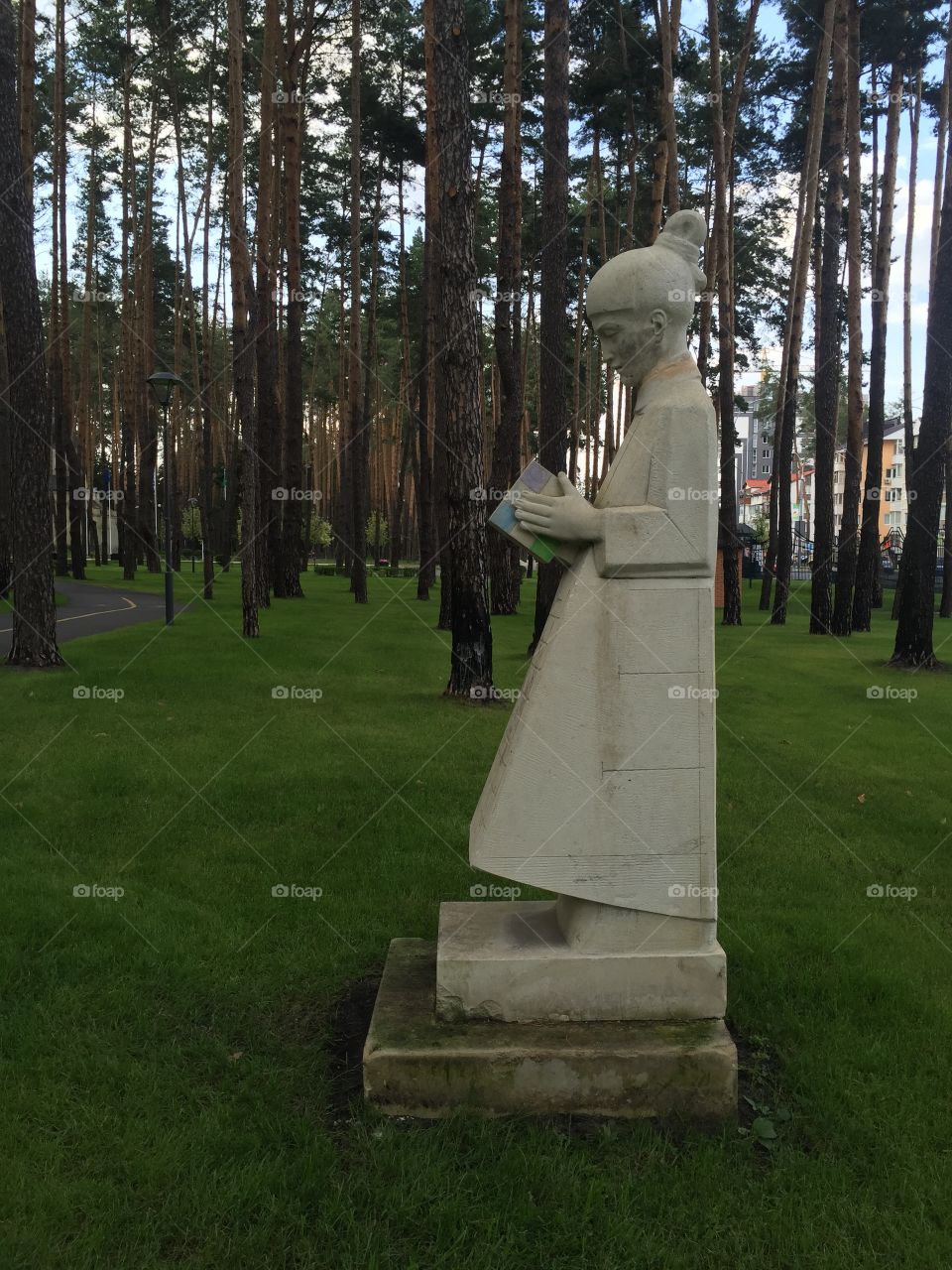 Statue of a girl with a brick