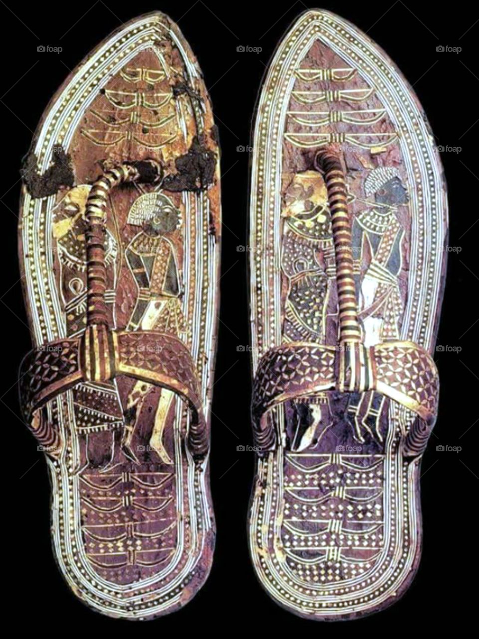 King Tut sandals on which his enemies were drawn .