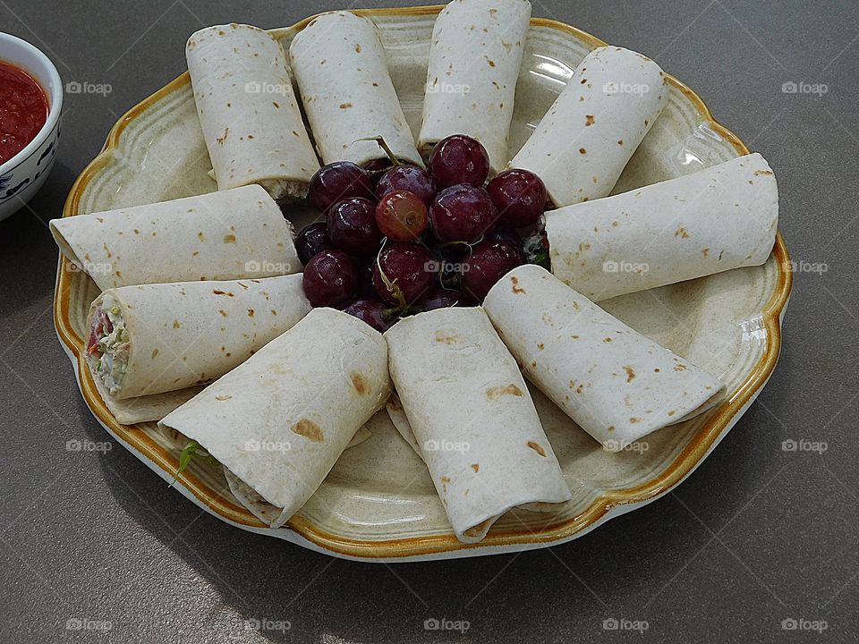 Chicken salad sandwiches in rollups with a side dish of tantalizing grapes is my favorite sandwich 