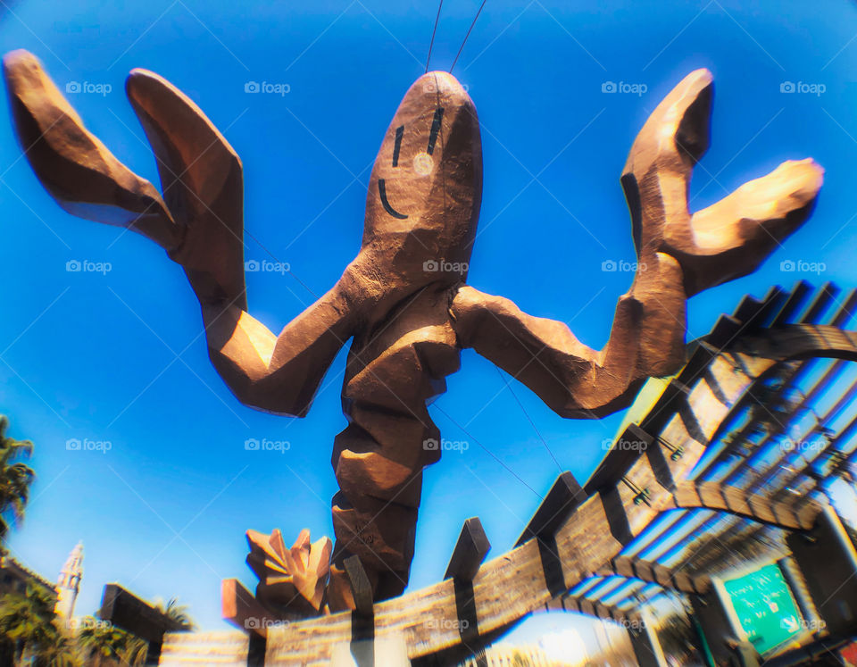 The Gambrinus sculpture (in Spanish, La Gamba) , also known as Mariscal’s Prawn, Port Vell Barcelona. Here The Prawn’s grinning form looms over us against a sci-fi blue sky