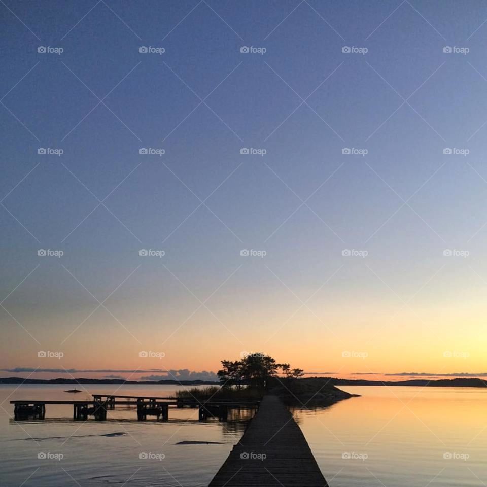 Silhouette of long pier in the archipelago of Stockholm
