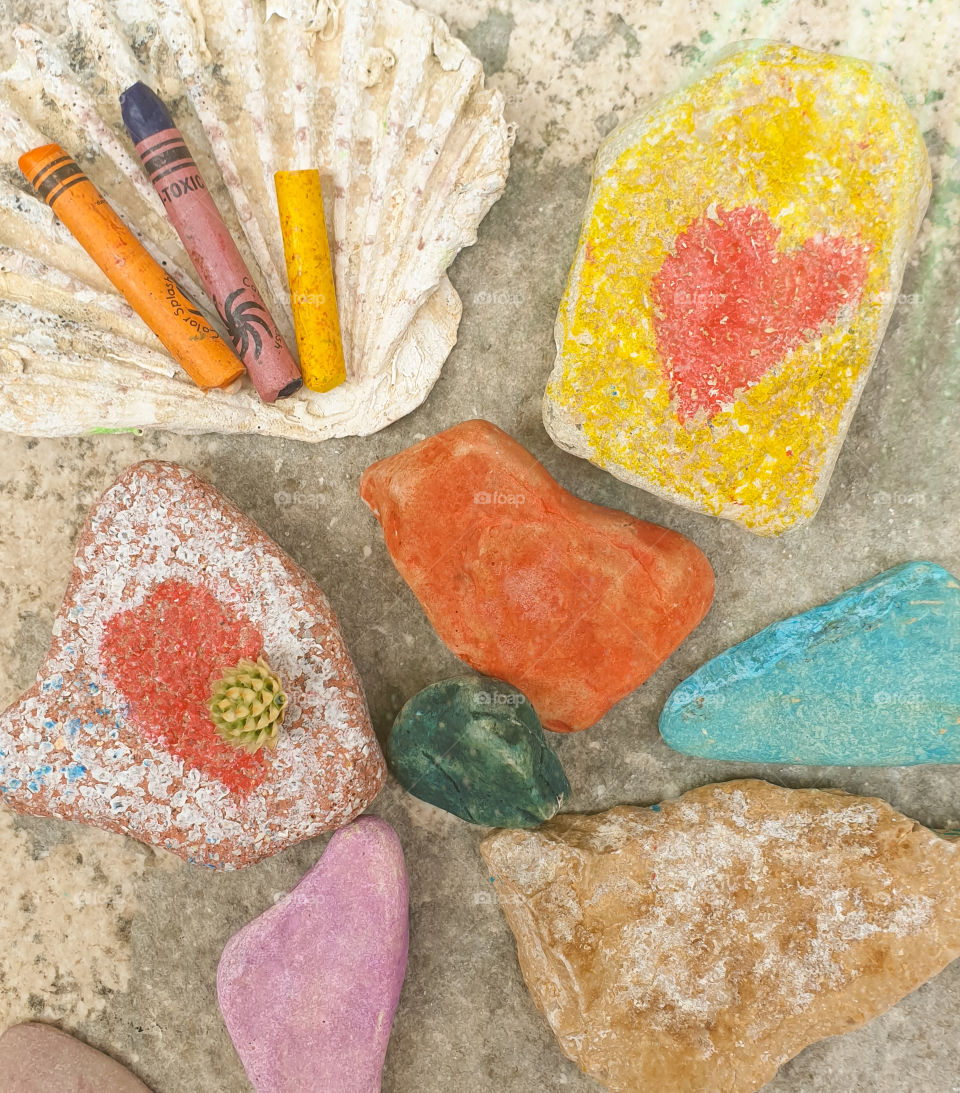 Children's creativity.  Children's favorite pastime at sea, painting and drawings on sea stones with crayons, pastels, watercolors, felt-tip pens
