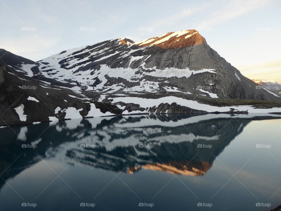 Sunrise over a very calm Coleman Lake