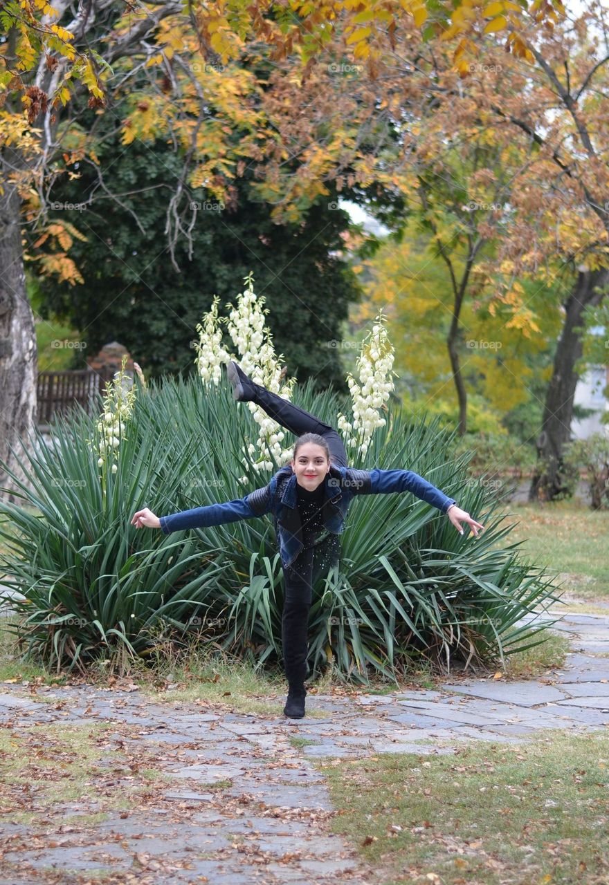 Beautiful Young Girl Dancing Outside in Nature