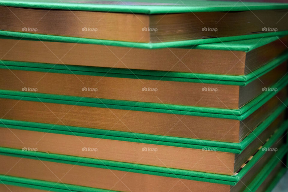 A stack of green books 