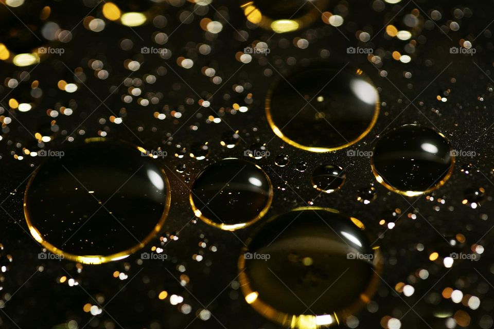 Golden oil Bubbles Close Up background amazing colours droplets of life in black texture macro look summer mood positive vibes wonderful day hustling daydreaming