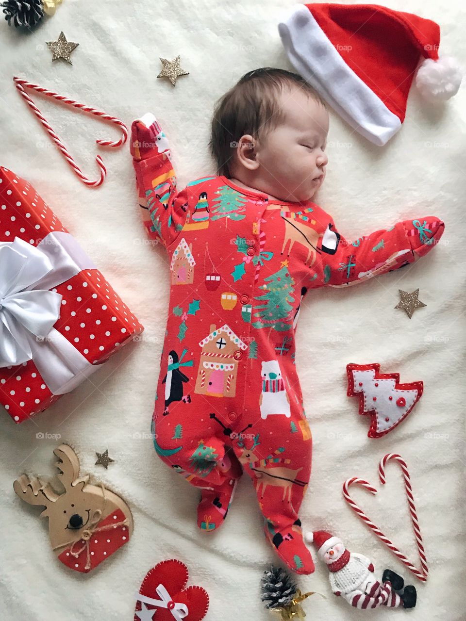 baby sleeping in a New Year's suit