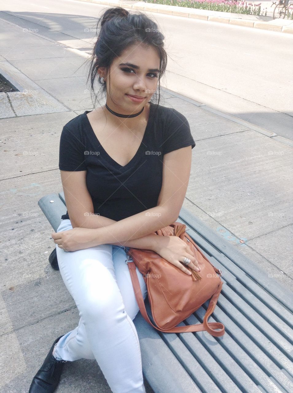 Beautiful girl sitting on bench